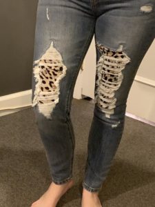cow print distressed jeans