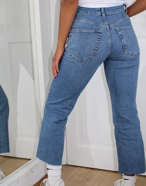 ASOS DESIGN Petite high rise stretch 'effortless' crop kick flare jeans in vintage midwash
