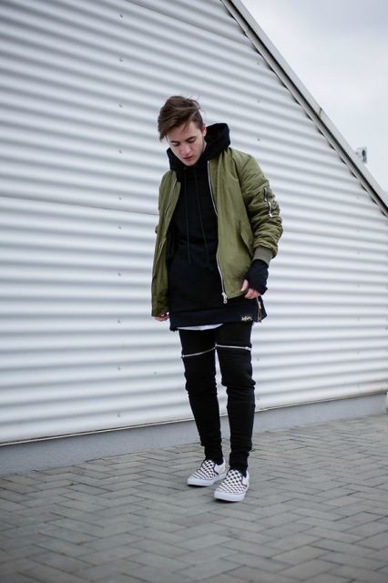green hoodie with black tees and printed shoes